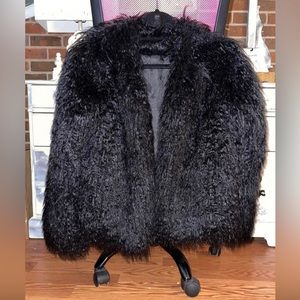 Black Boohoo brand Faux fur jacket. US size 4, I wear 8-10 and it fits me. New